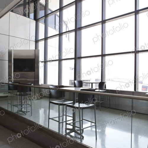 Tables and chairs at a cafe in an airport departure area. Tables and chairs at a cafe in an airport departure area.