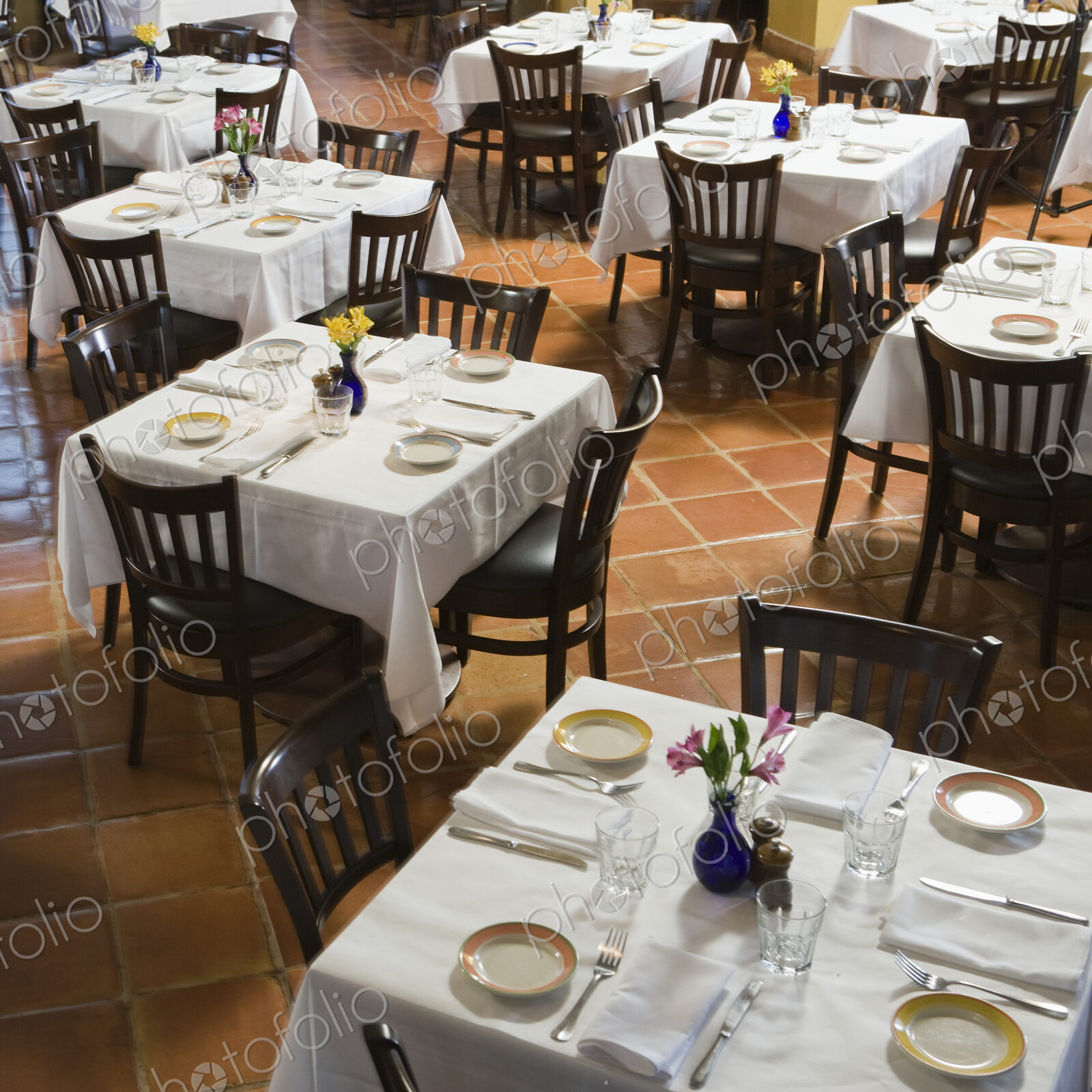 Tables and chairs in empty restaurant