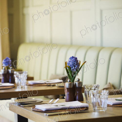 Tables set in the dining room at a boutique hotel in Gloucestershire. Tables set in the dining room at a boutique hotel in Gloucestershire.