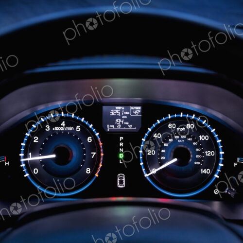Tachometer, car dashboard,instrument panel,and fuel gauge. A speedometer Tachometer, car dashboard,instrument panel,and fuel gauge. A speedometer