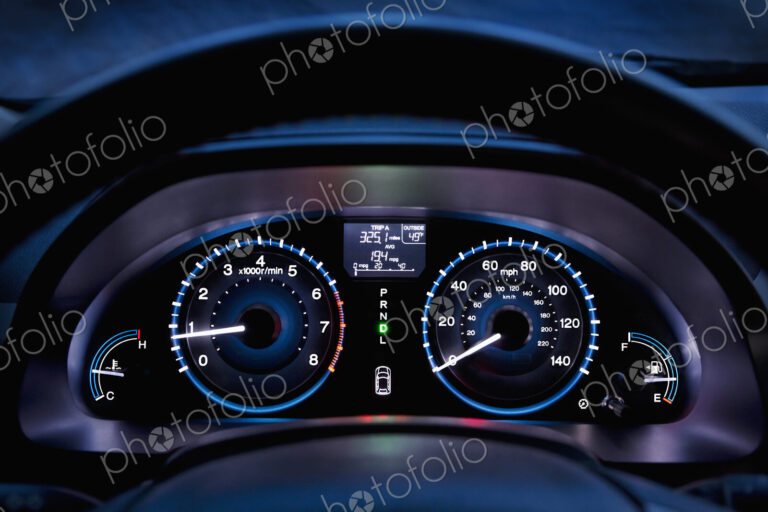Tachometer, car dashboard,instrument panel,and fuel gauge. A speedometer