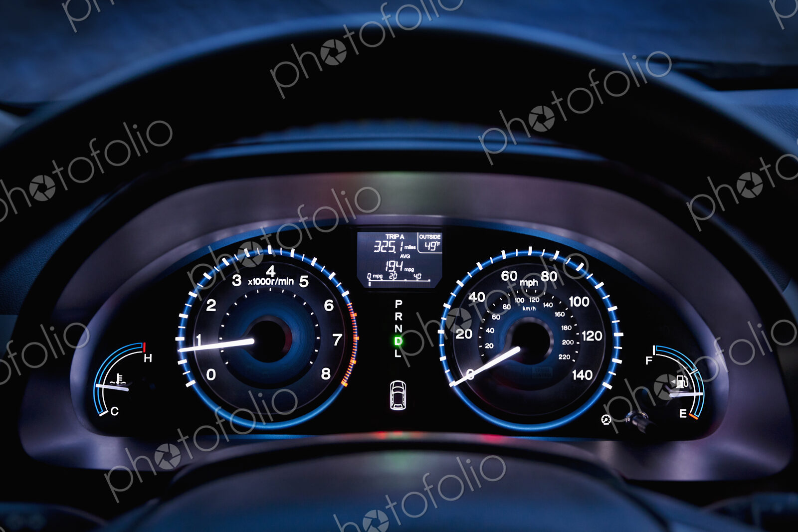 Tachometer, car dashboard,instrument panel,and fuel gauge. A speedometer