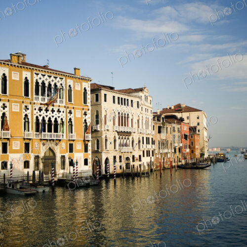 Tall palazzos and historic buildings lining the Grand Canal in Venice.