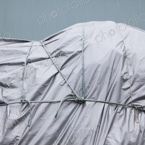 Tarpaulin and rope covering commercial fishing nets at Fisherman's Terminal. Tarpaulin and rope covering commercial fishing nets at Fisherman's Terminal.