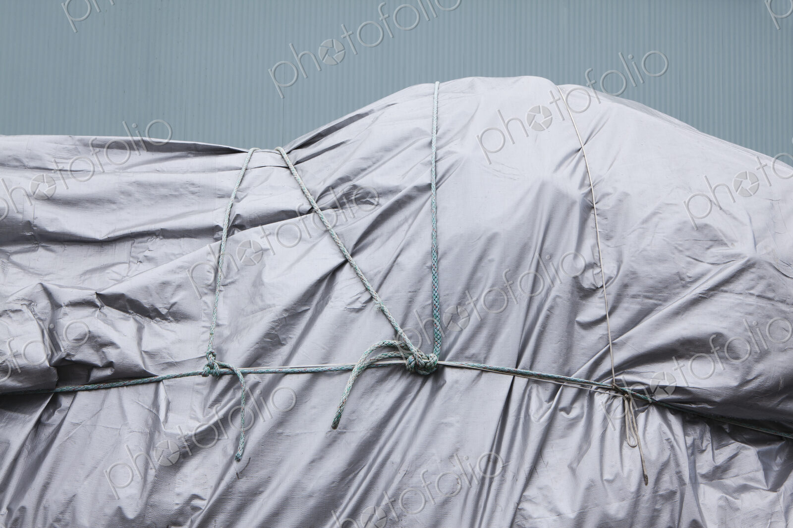 Tarpaulin and rope covering commercial fishing nets at Fisherman’s Terminal.