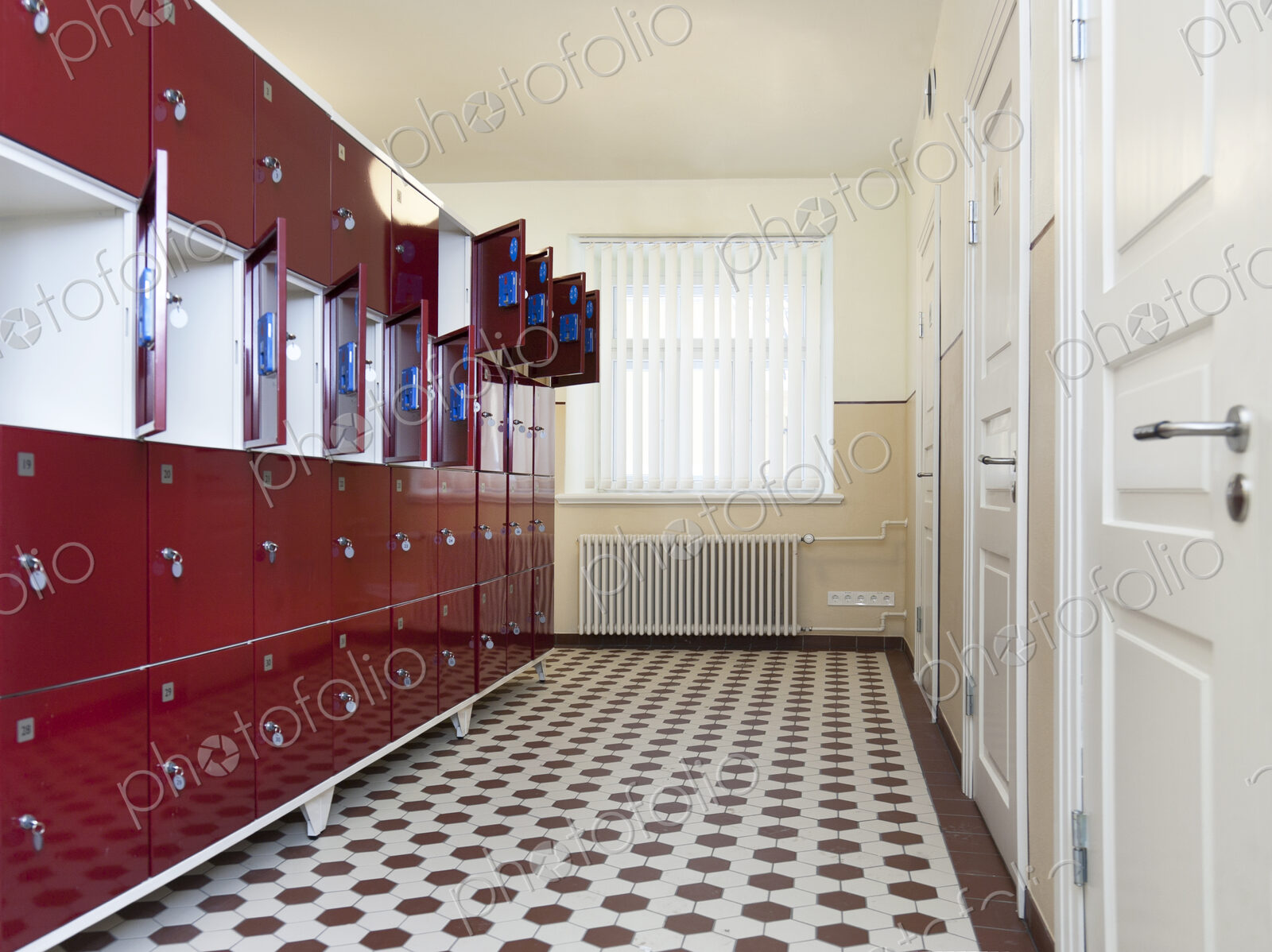 Tartu University in Estonia, interior view of locker room with red metal lockable…