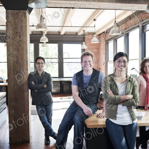 Team of mixed race workers in a creative office. Team of mixed race workers in a creative office.