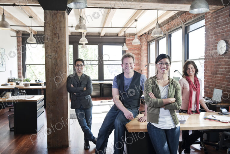 Team of mixed race workers in a creative office.