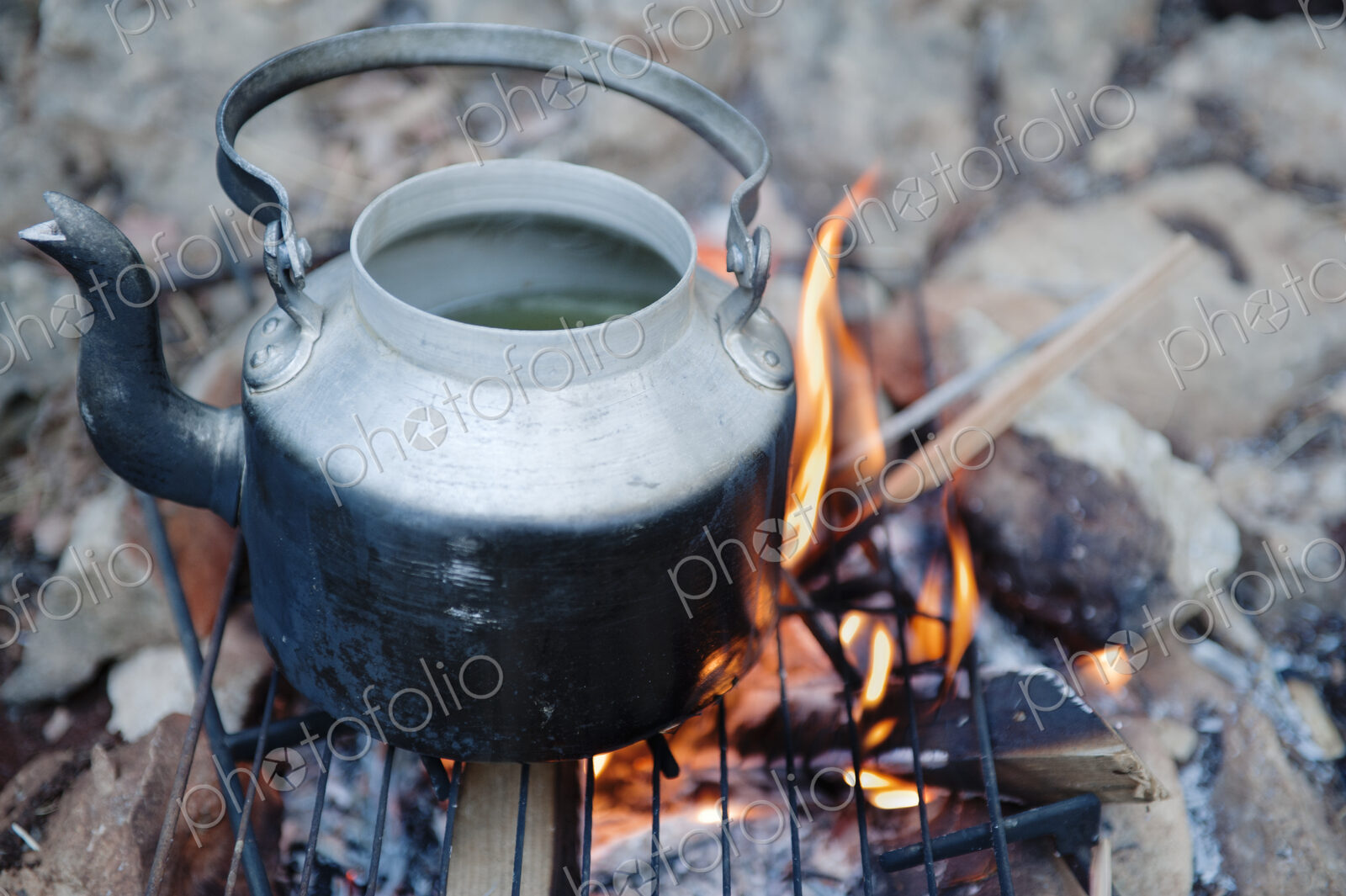 Teapot on campfire