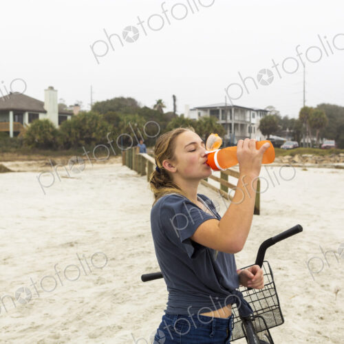 Teenage girl drinking water, St. Simon's Island Georgia Teenage girl drinking water, St. Simon's Island Georgia