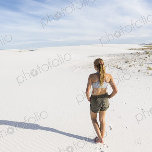 Teenage girl looking over the landscape at White Sands Nat'l Monument, NM Teenage girl looking over the landscape at White Sands Nat'l Monument, NM