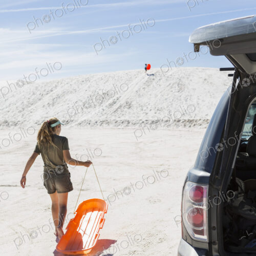 Teenage girl with sled, White Sands Nat'l Monument, NM Teenage girl with sled, White Sands Nat'l Monument, NM