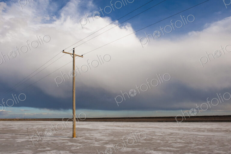Telephone pole in remote landscape, West Desert, Utah, United States