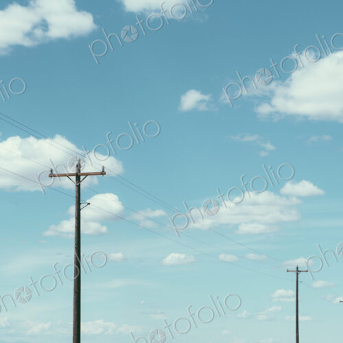 Telephone poles, power lines and cloudy sky, near Quincy Telephone poles, power lines and cloudy sky, near Quincy