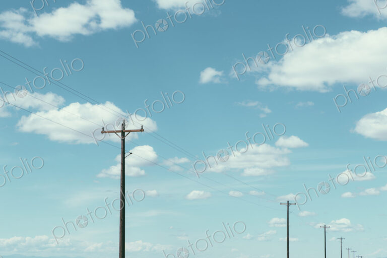 Telephone poles, power lines and cloudy sky, near Quincy