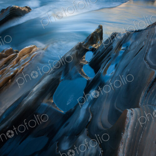 Textured rock at the edge of a stream, Jasper National Park, Alberta, Canada Textured rock at the edge of a stream, Jasper National Park, Alberta, Canada