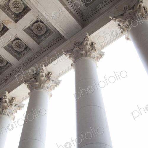 The American Capitol Building, a low angle view of the tall columns with gilded carved… The American Capitol Building, a low angle view of the tall columns with gilded carved…