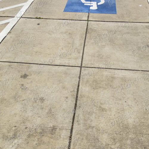 The American blue ADA symbol for wheelchair access or wheelchair use on a path. The American blue ADA symbol for wheelchair access or wheelchair use on a path.