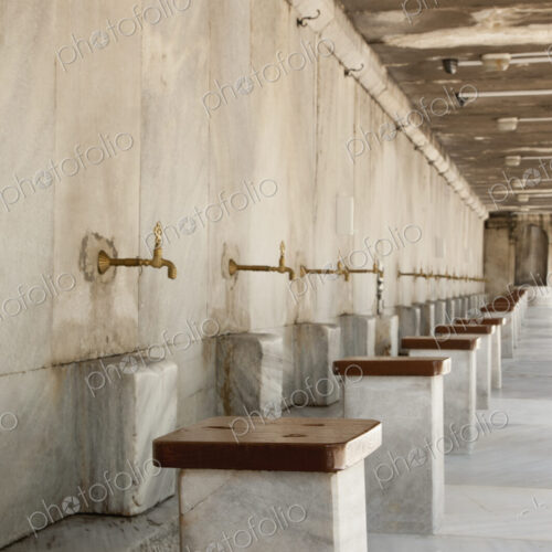 The Blue Mosque, Istanbul, a row of marble seats and taps for the worshippers to wash… The Blue Mosque, Istanbul, a row of marble seats and taps for the worshippers to wash…