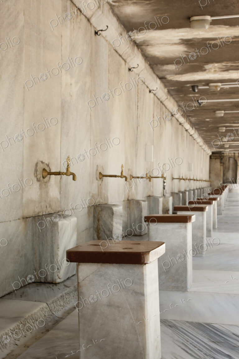 The Blue Mosque, Istanbul, a row of marble seats and taps for the worshippers to wash…