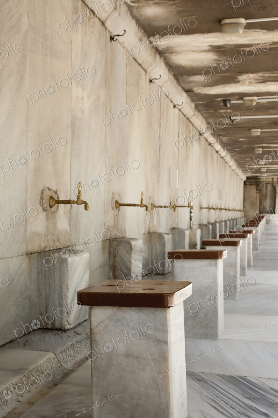 The Blue Mosque, Istanbul, a row of marble seats and taps for the worshippers to wash…