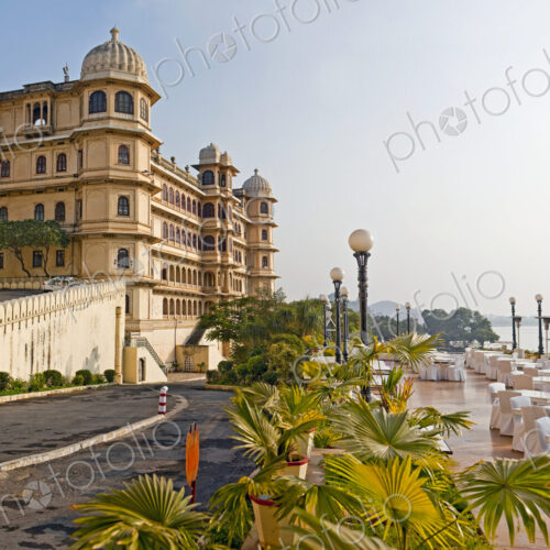 The City Palace historic palace building on the shores of the lake at Udaipur India.