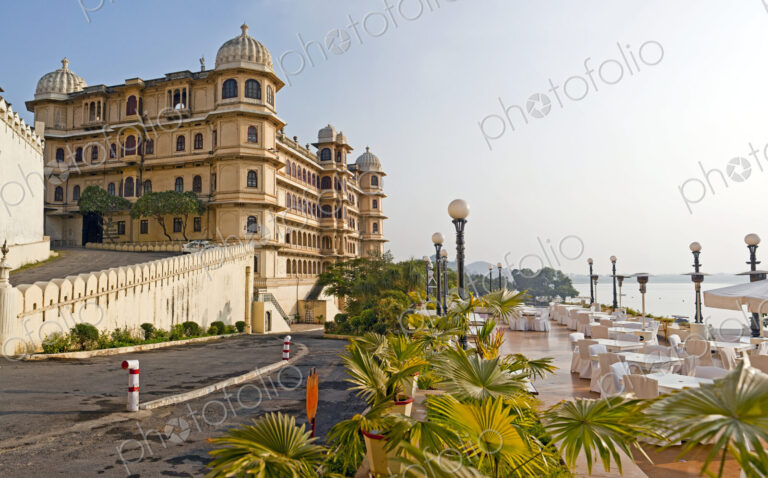 The City Palace historic palace building on the shores of the lake at Udaipur India.