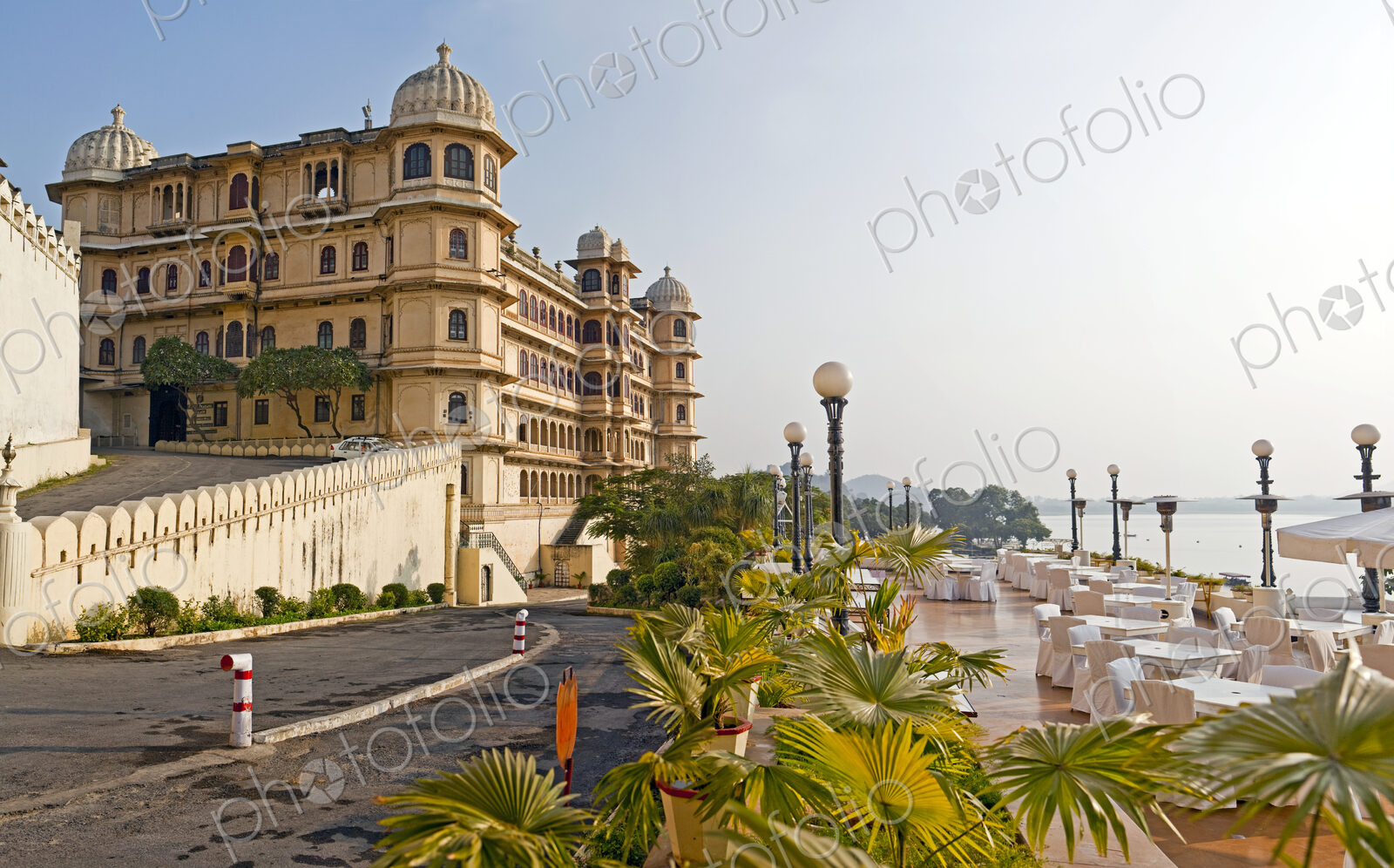 The City Palace historic palace building on the shores of the lake at Udaipur India.