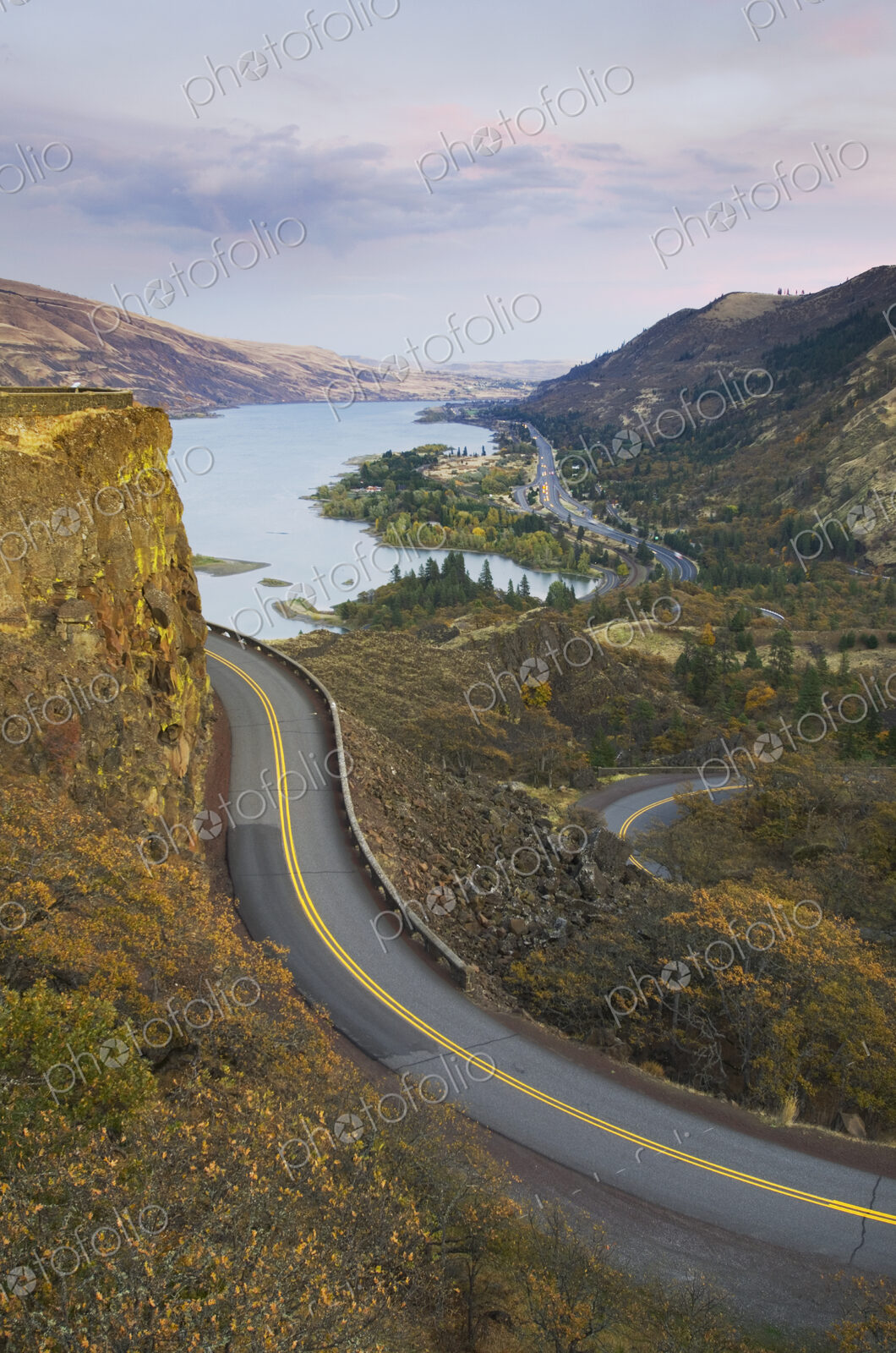 The Columbia River Highway from Rowena Crest, view of a road and lake.
