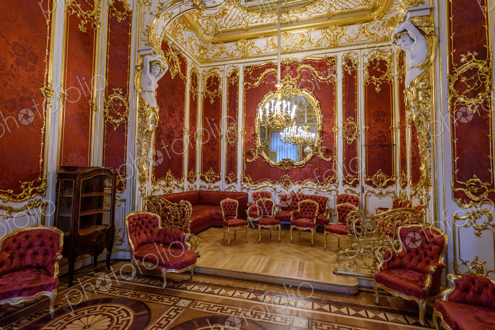 The Hermitage museum, the Winter Palace of the Tzars, the Gold Drawing Room with red…