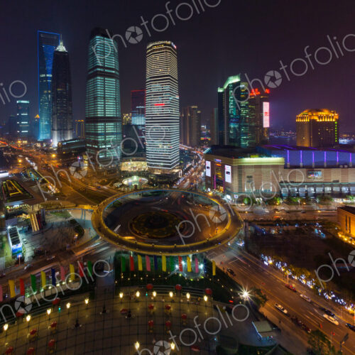 The Lujiazui Traffic Circle, with an elevated pedestrian promenade, at night,…