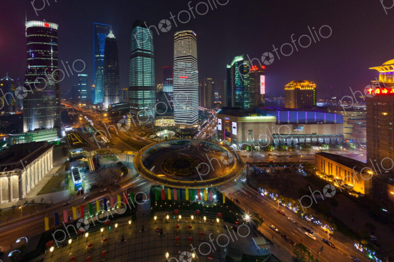 The Lujiazui Traffic Circle, with an elevated pedestrian promenade, at night,…