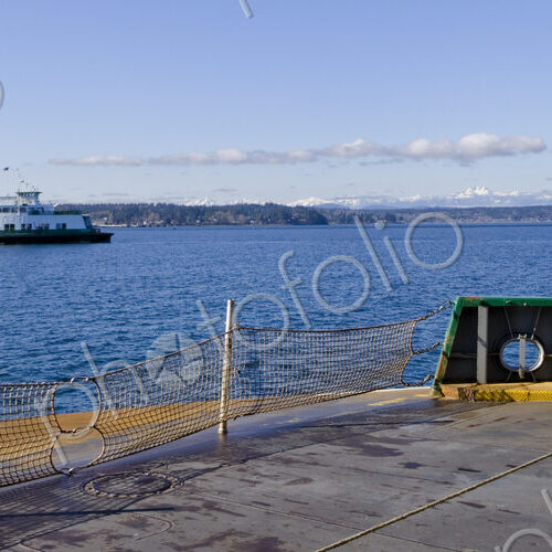 The M.V. Issaquah Ferry boat en route to Vashon Island, offshore on a sunny winter day. The M.V. Issaquah Ferry boat en route to Vashon Island, offshore on a sunny winter day.