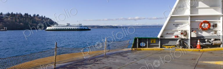 The M.V. Issaquah Ferry boat en route to Vashon Island, offshore on a sunny winter day.