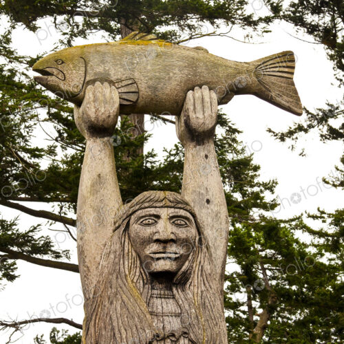The Maiden of the Pass statue of a Samish Indian Nation fisherman holding a fish above… The Maiden of the Pass statue of a Samish Indian Nation fisherman holding a fish above…