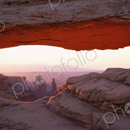 The Mesa Arch, a natural eroded rock arch, in Canyonlands National Park. The Mesa Arch, a natural eroded rock arch, in Canyonlands National Park.