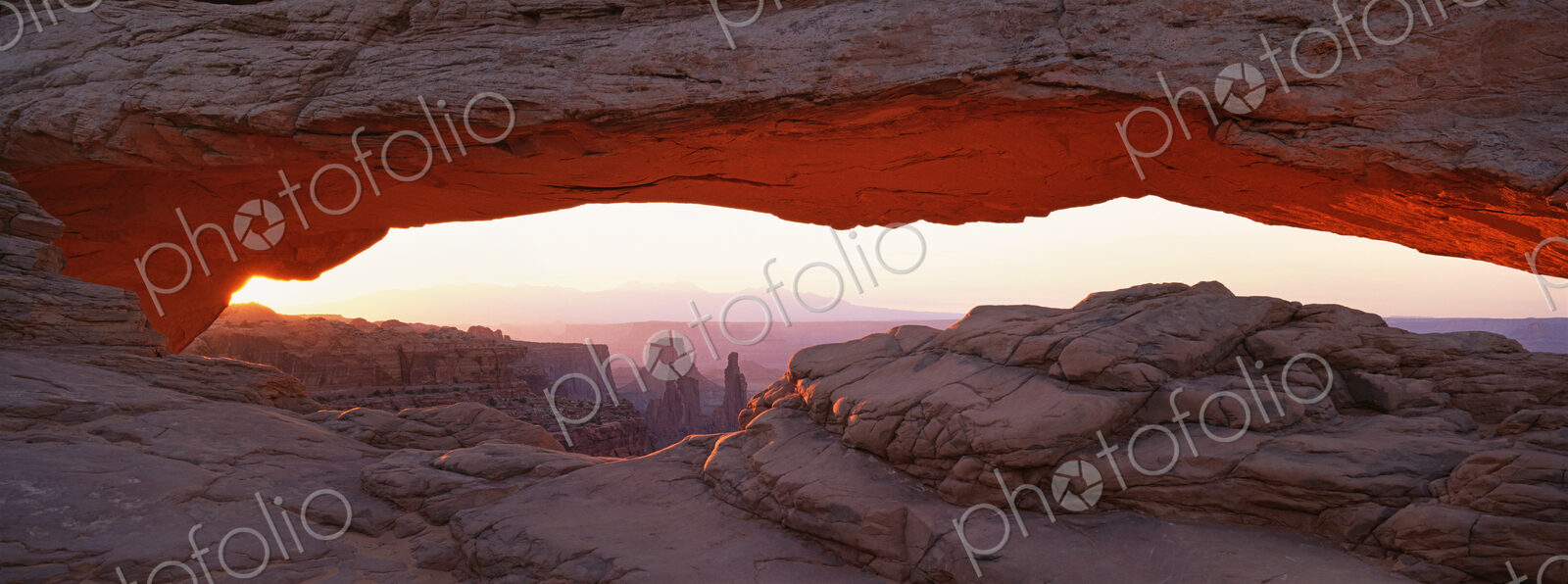 The Mesa Arch, a natural eroded rock arch, in Canyonlands National Park.