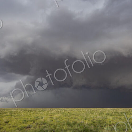 The Morton Supercell, Tornado-Producing Supercell, clouds gathering above the ground,…