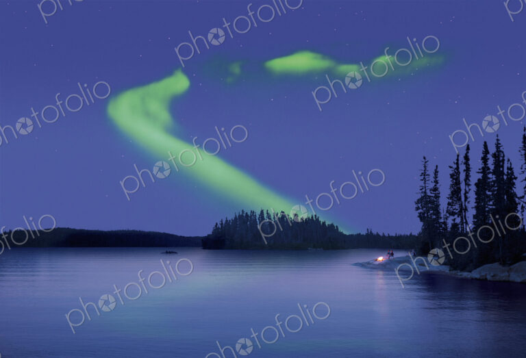The Northern Lights in the night sky, the Aurora borealis above a calm lake. Two…