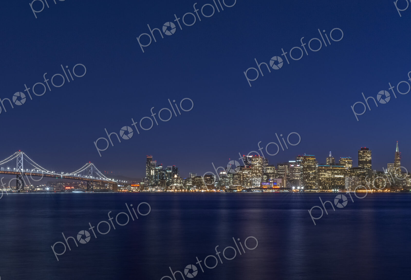 The San Francisco Bay Bridge & Downtown Skyline at Twilight