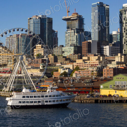 The Seattle Great Wheel and Argosy tour boat with Seattle skyline The Seattle Great Wheel and Argosy tour boat with Seattle skyline