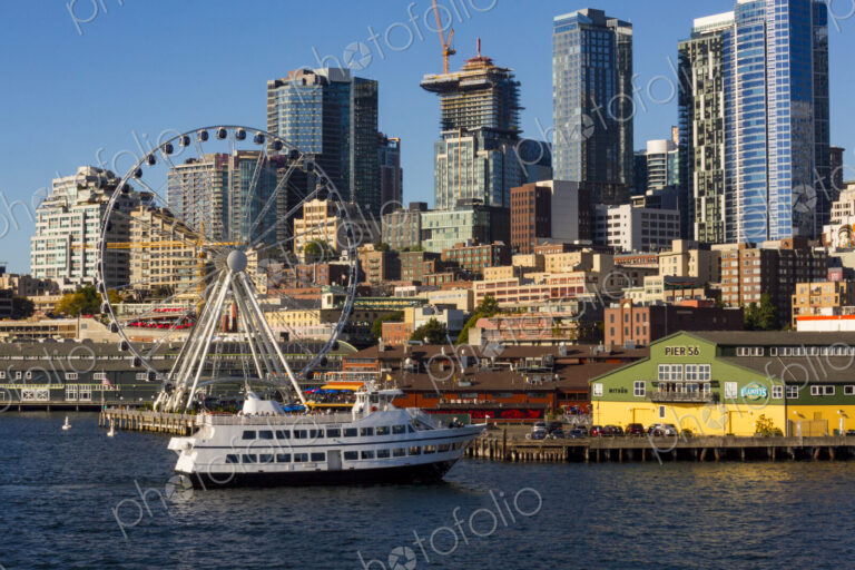 The Seattle Great Wheel and Argosy tour boat with Seattle skyline