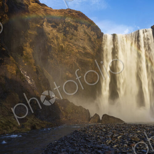The Skagafoss waterfall, a tall cascade over a sheer cliff, mist and a Double Rainbow… The Skagafoss waterfall, a tall cascade over a sheer cliff, mist and a Double Rainbow…