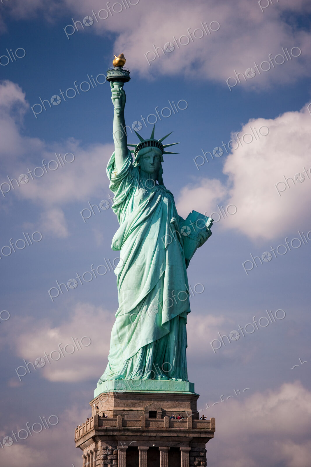 The Statue of Liberty is a national symbol and stands overlooking New York harbour on…