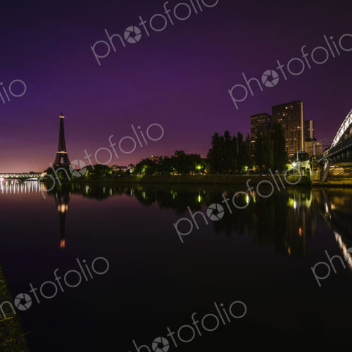 The city at night, view along the River Seine to the Tour Eiffel, buildings and roads… The city at night, view along the River Seine to the Tour Eiffel, buildings and roads…
