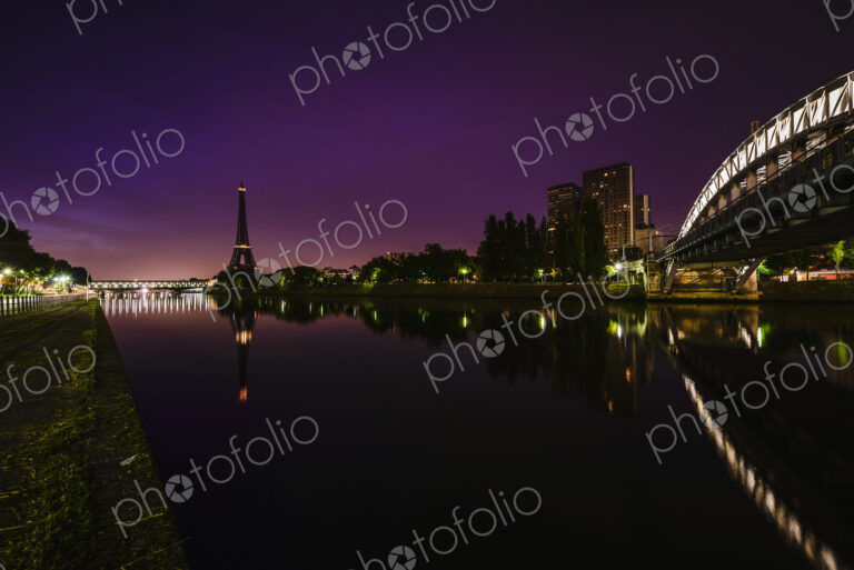 The city at night, view along the River Seine to the Tour Eiffel, buildings and roads…