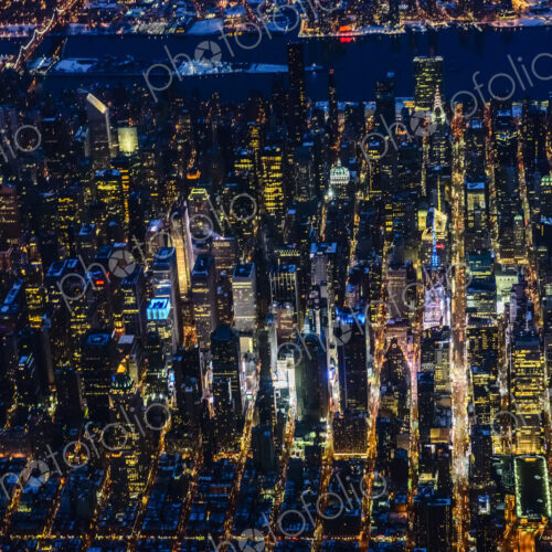 The city of New York City, Manhattan, aerial view at night. The city of New York City, Manhattan, aerial view at night.