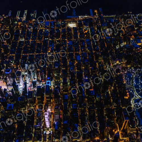 The city of New York City, Manhattan, aerial view at night. The city of New York City, Manhattan, aerial view at night.