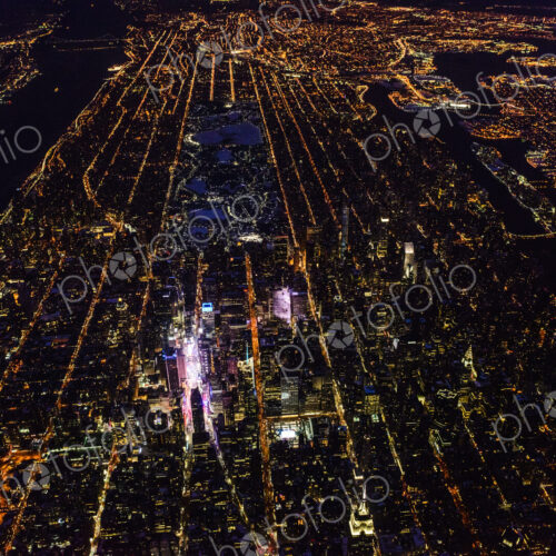 The city of New York City, Manhattan, aerial view at night. The city of New York City, Manhattan, aerial view at night.