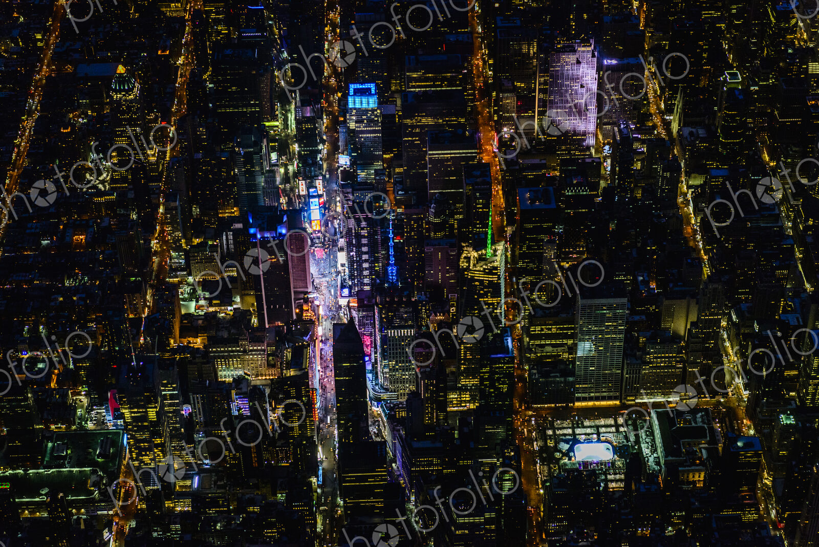 The city of New York City, Manhattan, aerial view at night.